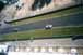 A closer view of the cars leaving the Porsche curves, coming down in front of the Audi hospitality tent 